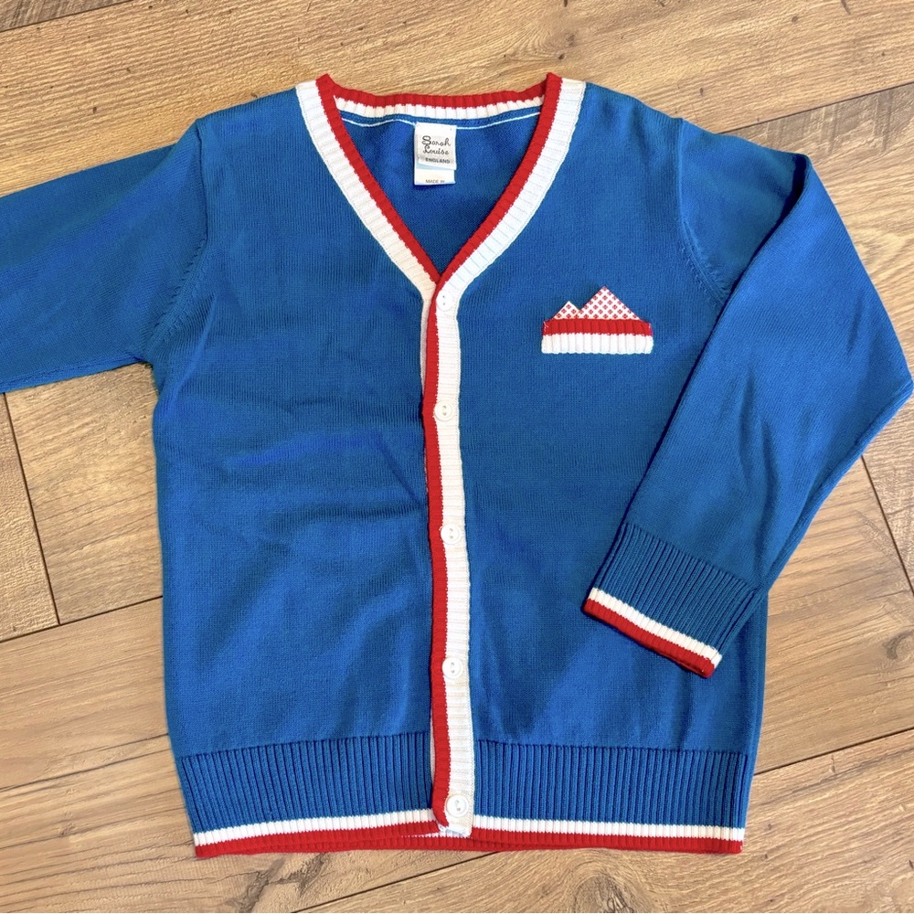 Sarah Louise (England) blue cardigan with handkerchief pocket (sewn in). Size 7.